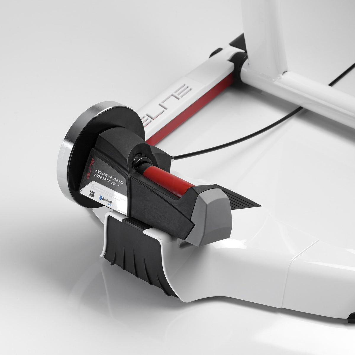 Elite Qubo Power Mag Smart B+ magnetic unit with Bluetooth label and cable to the handlebar selector