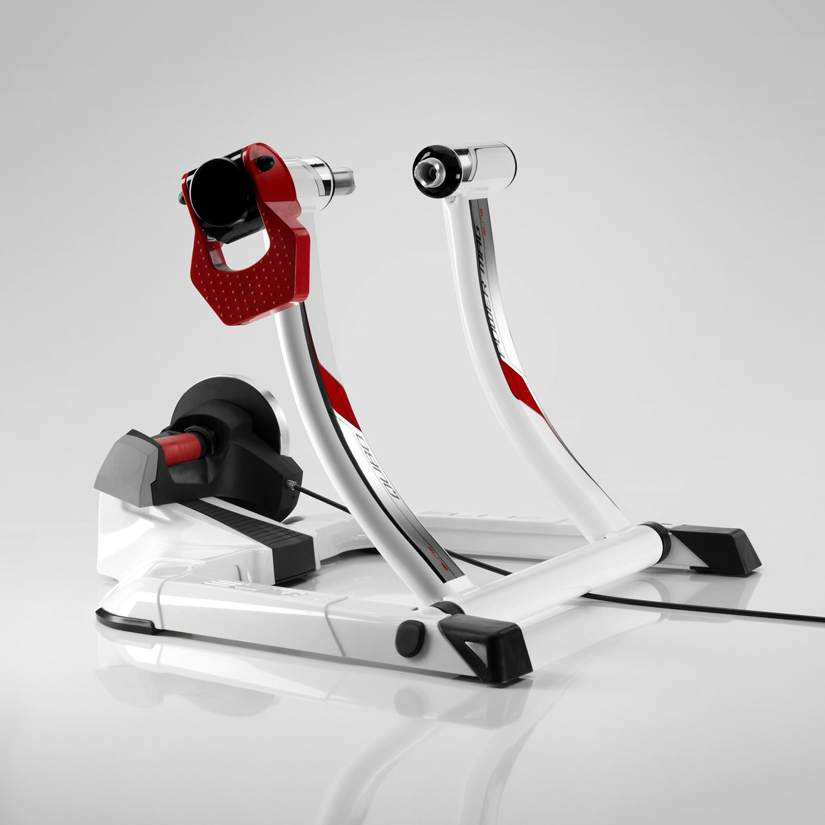 Elite Qubo Power Mag Smart B+ trainer front three-quarter view with sensor cable running from the unit