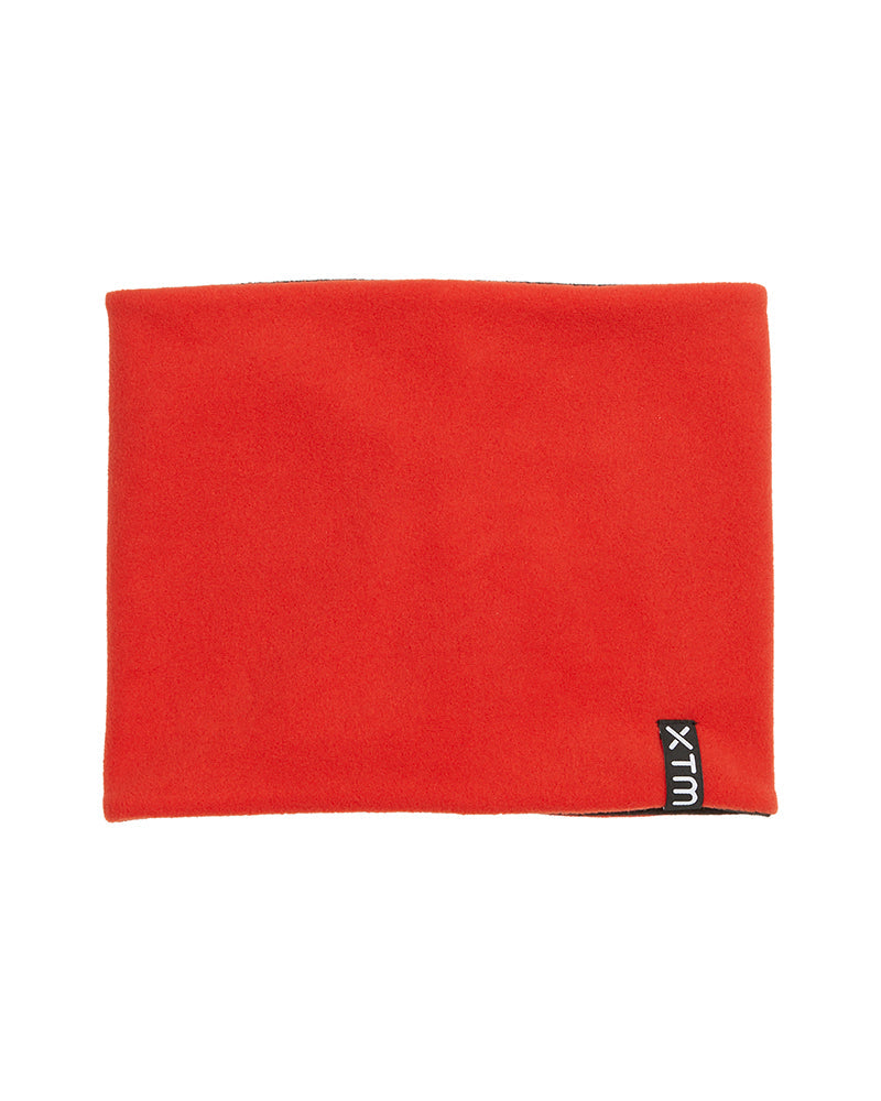 XTM Kids Microfleece X neck warmer in Lava red-orange fleece with the XTM label on the edge