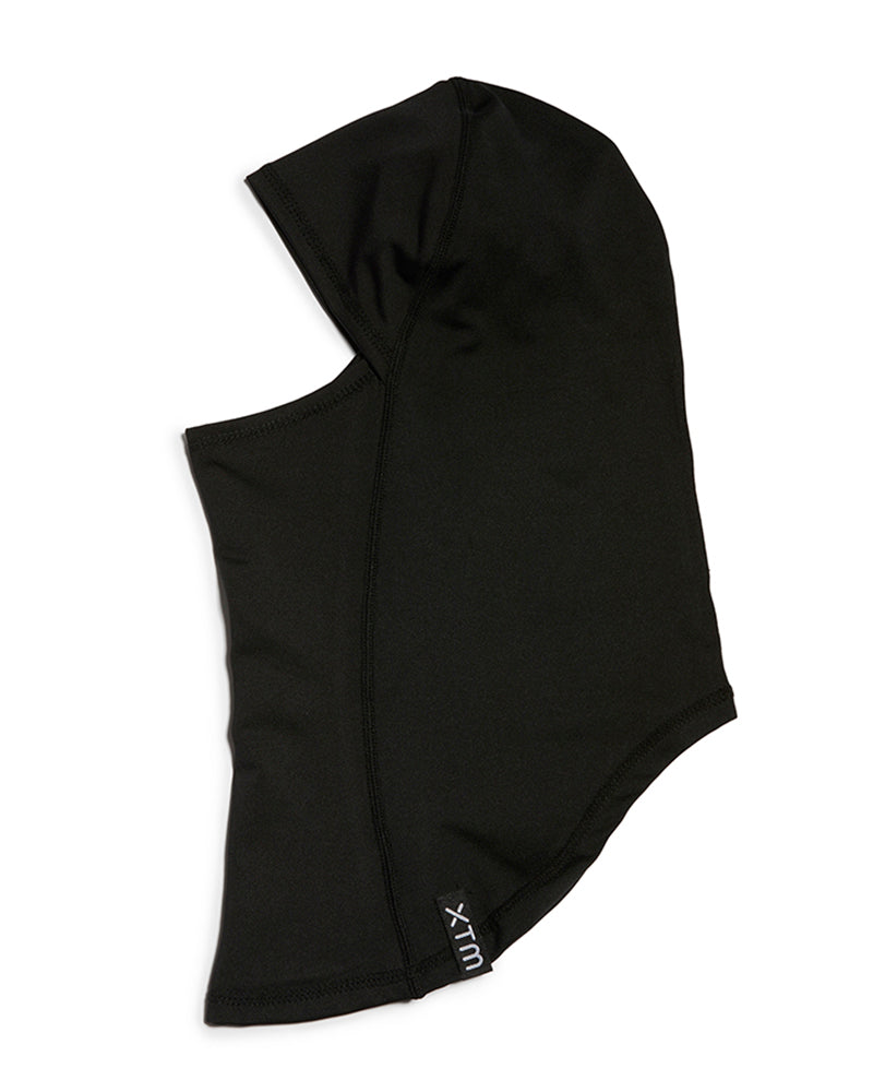 XTM Kids Blindside balaclava in Black, side view showing the face opening and woven XTM label