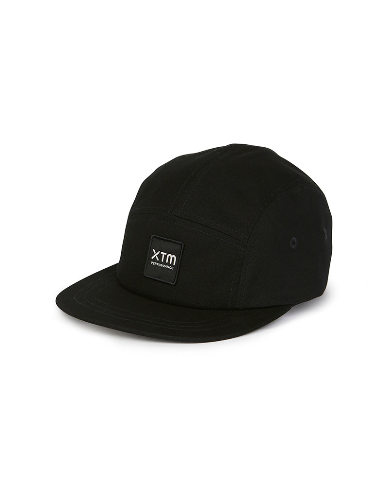 XTM Hakea organic cotton cap in Black, three-quarter product view with logo patch