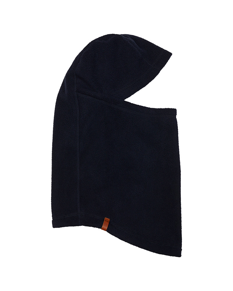 Navy XTM Nano II microfleece balaclava laid flat in side profile with tan woven label at the hem