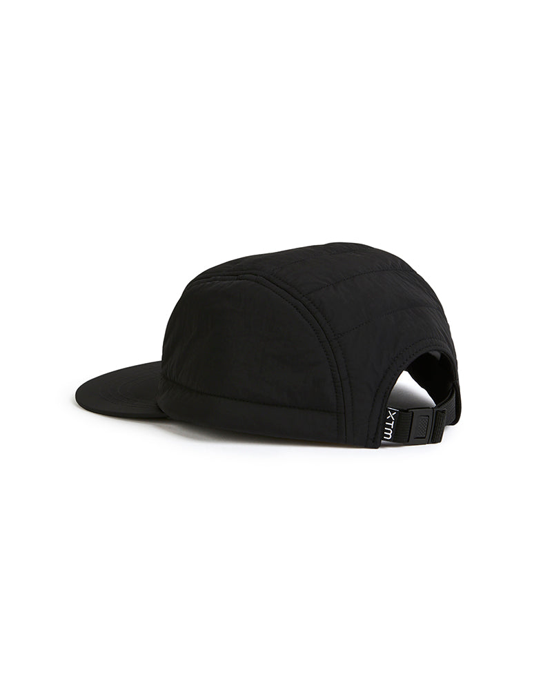 Back view of the black XTM Alpine Puffer Cap showing the adjustable buckle strap and quilted crown