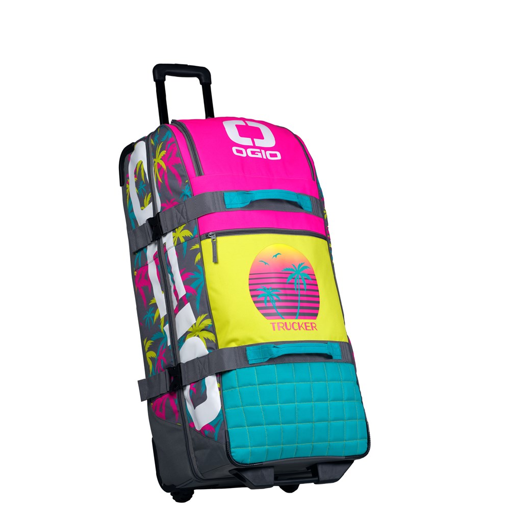 OGIO Trucker Gear Bag in Miami Vice, pink, yellow and teal palm-tree print marked TRUCKER
