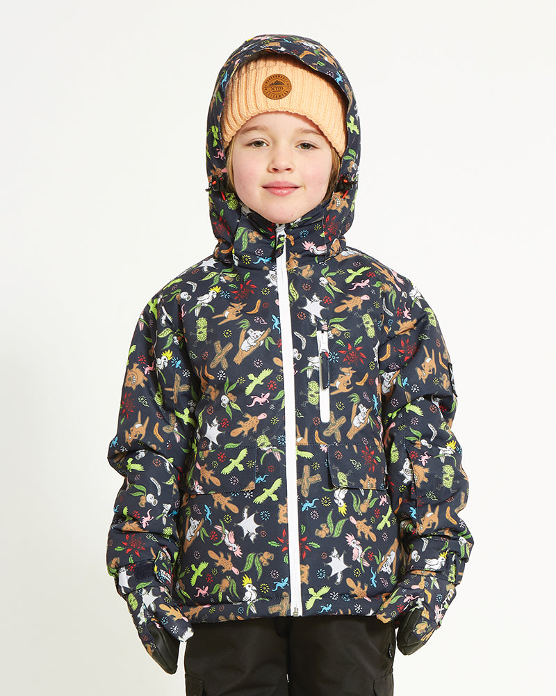 Child wearing the Woodland Navy XTM Kids Yama Snow Jacket with the hood up, front view, white zip