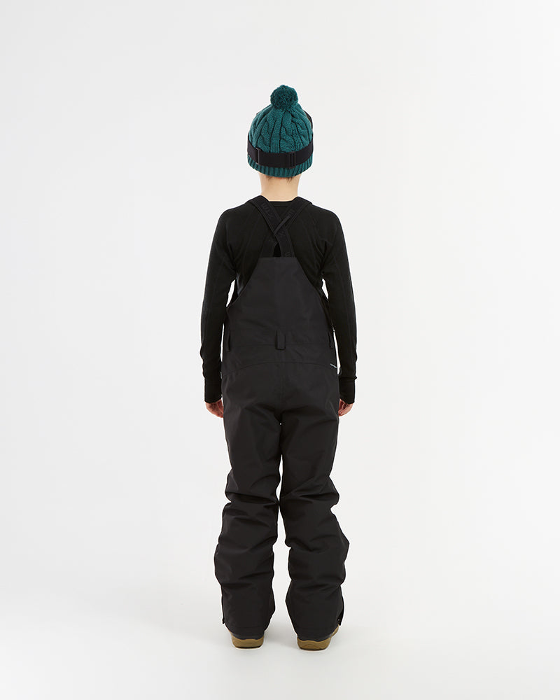 XTM Kids Bailey Ski Pant in Black, back view on a child showing the crossed straps