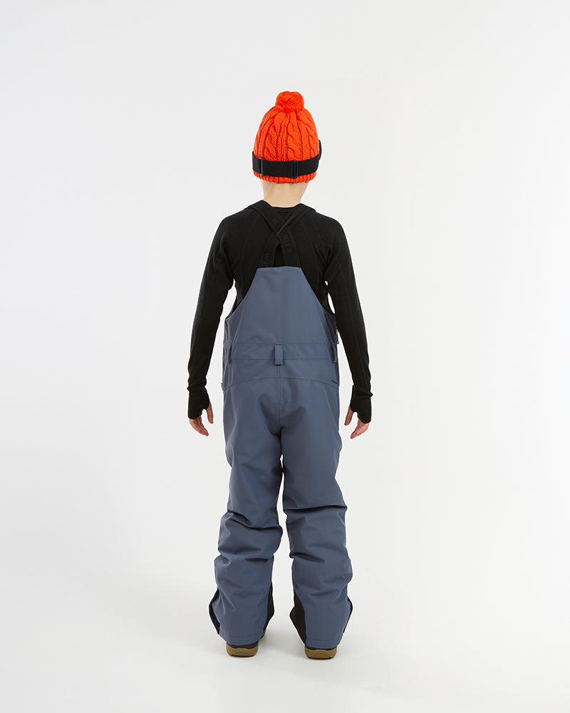 XTM Kids Bailey Ski Pant in Indigo Solid, back view on a child