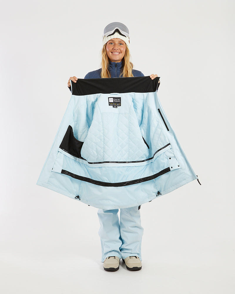 Sky Blue XTM Elevation II held open to show the quilted lining, inner pockets and powder skirt
