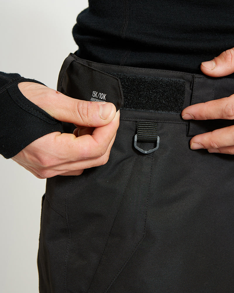 Black XTM Glide ski pant waistband with velcro adjuster and D-ring