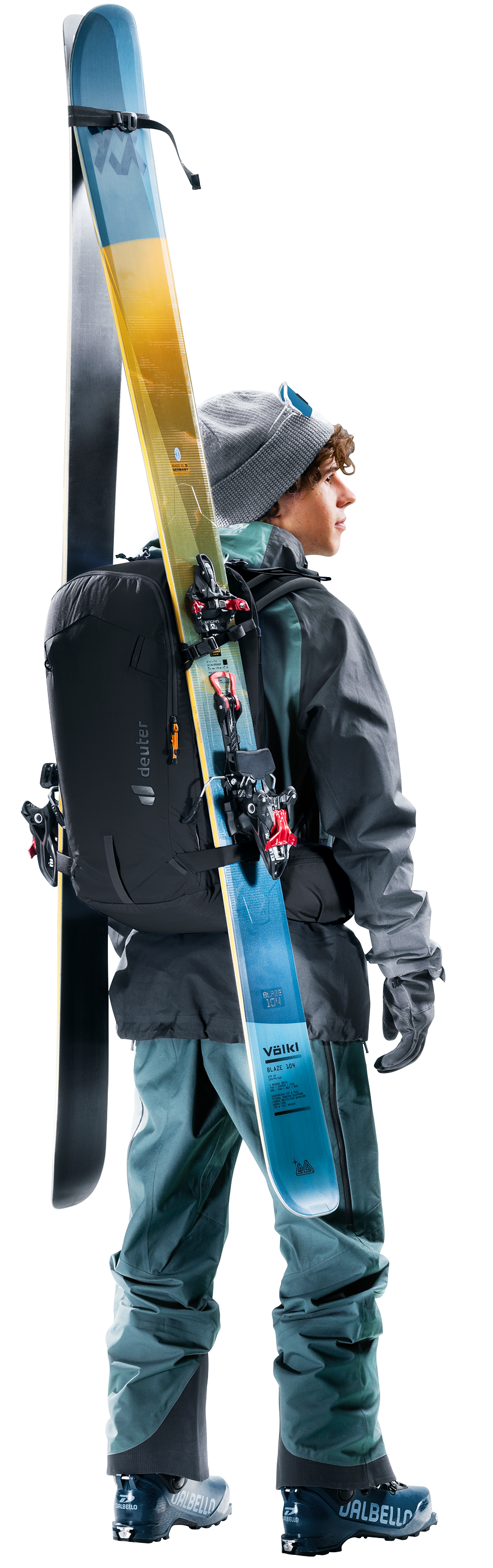 Skier wearing the Deuter Freerider 30 with skis strapped vertically at the side