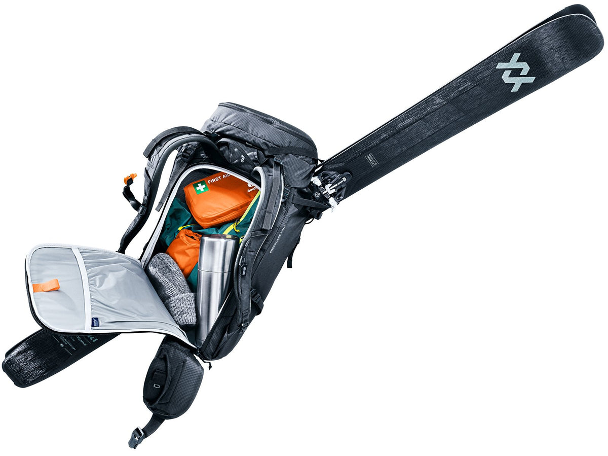 Deuter Freescape Tour 30 SL opened through the rear zip with skis still strapped on diagonally