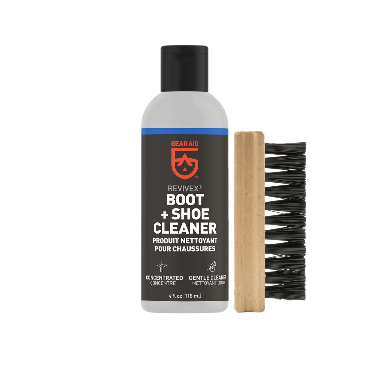 Revivex Boot and Shoe Cleaner bottle standing beside a wooden scrubbing brush
