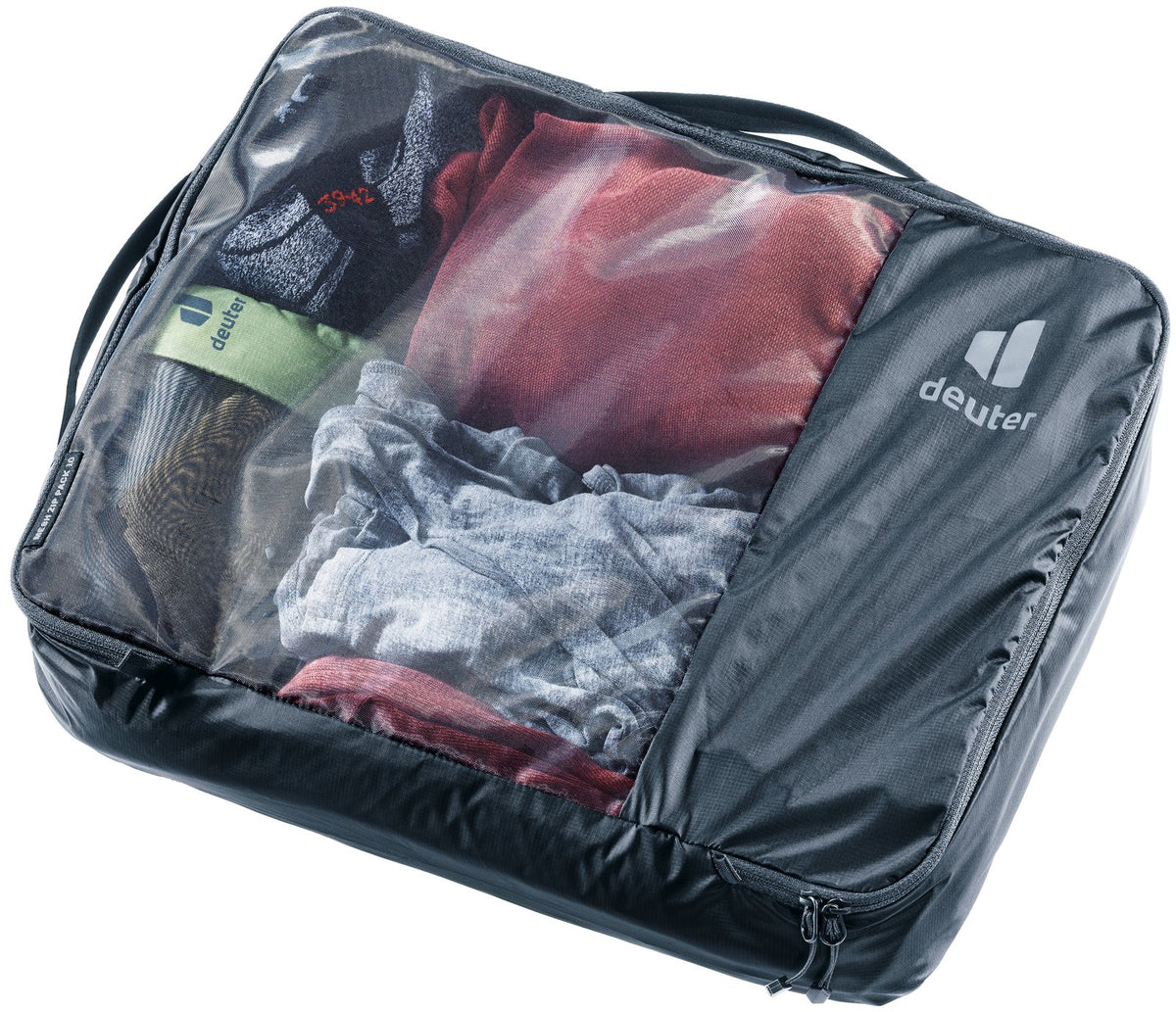Deuter Mesh Zip Pack 10 in Black, packed with clothes visible through the mesh top