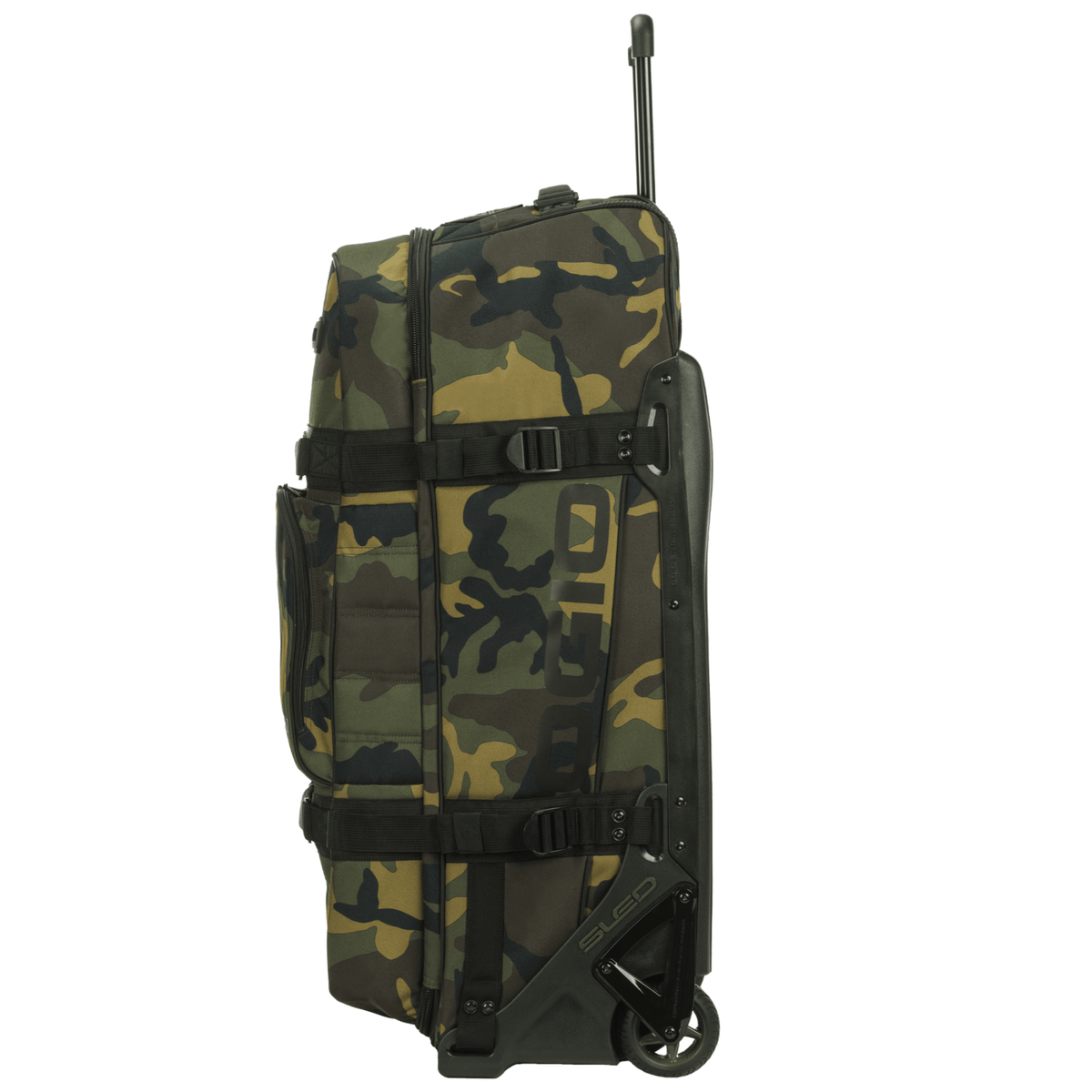 Side view of the OGIO Rig 9800 Pro in Woody camo with handle extended and grab handle