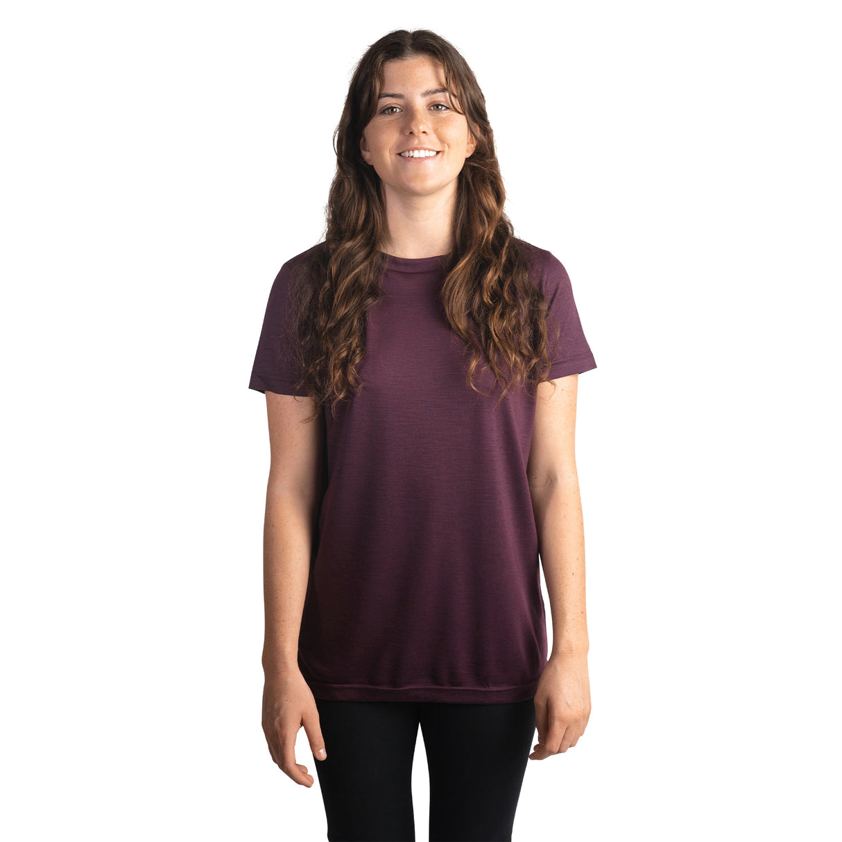 Front shot of Ottie Merino women's Plum short sleeve merino wool t-shirt on 166cm model who is wearing a size small