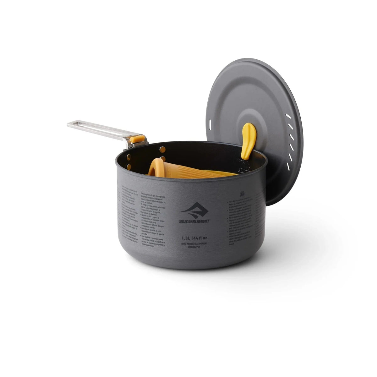 Frontier pot with the lid hanging from the LidKeep and yellow Passage tableware packed inside