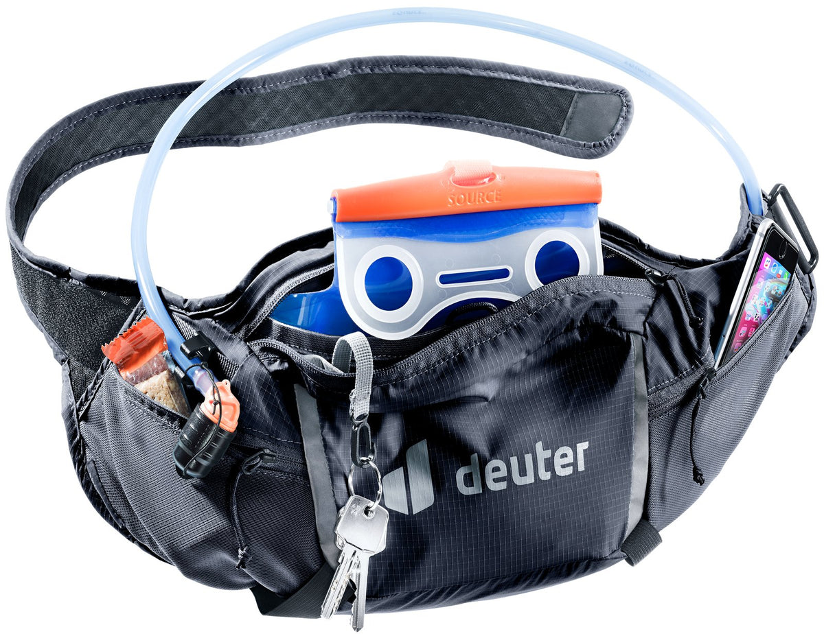 Deuter Shortrail III open with a hydration bladder (sold separately), phone, keys and gels