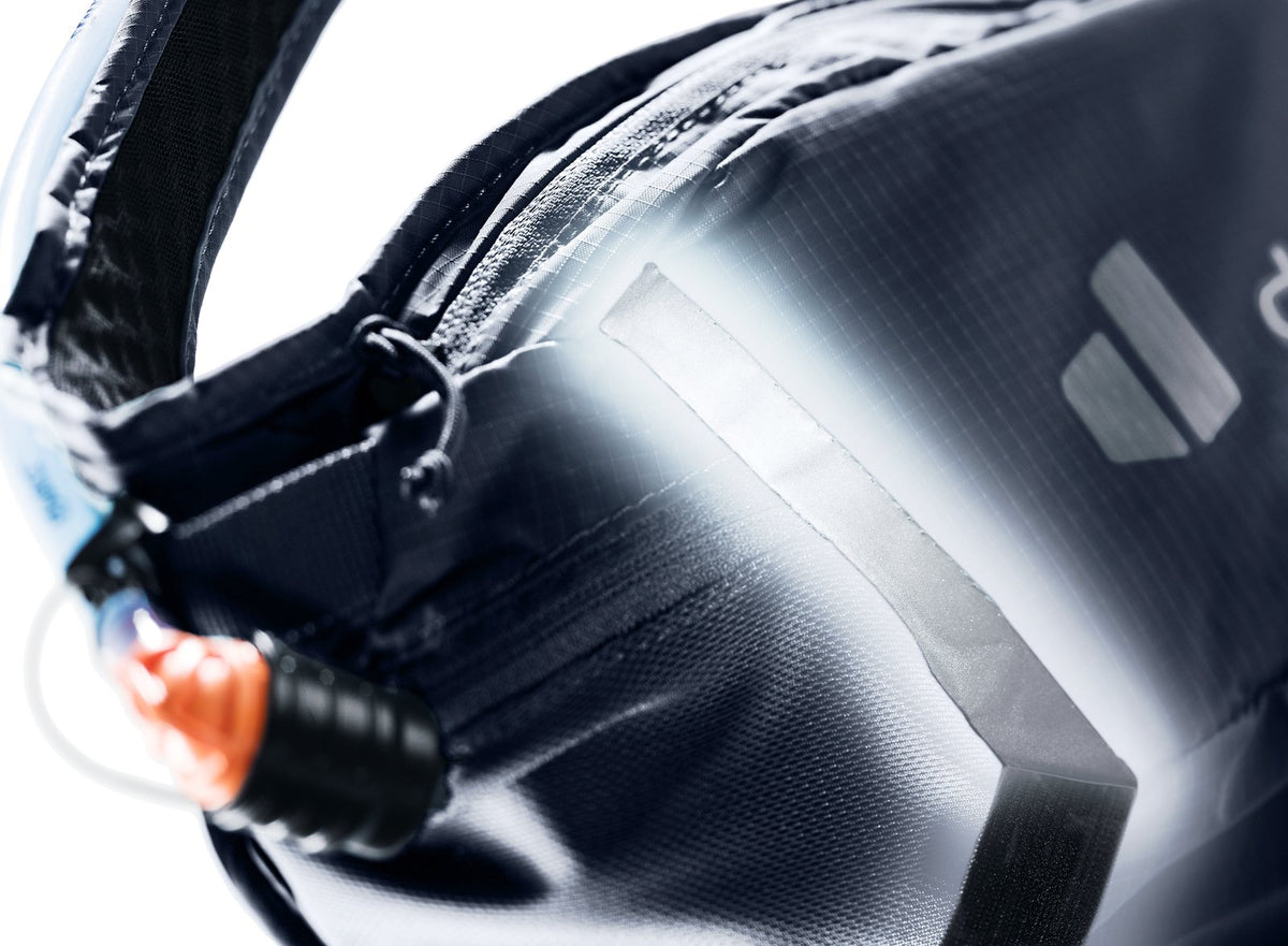 Close-up of the Deuter Shortrail III reflective detail and hose outlet