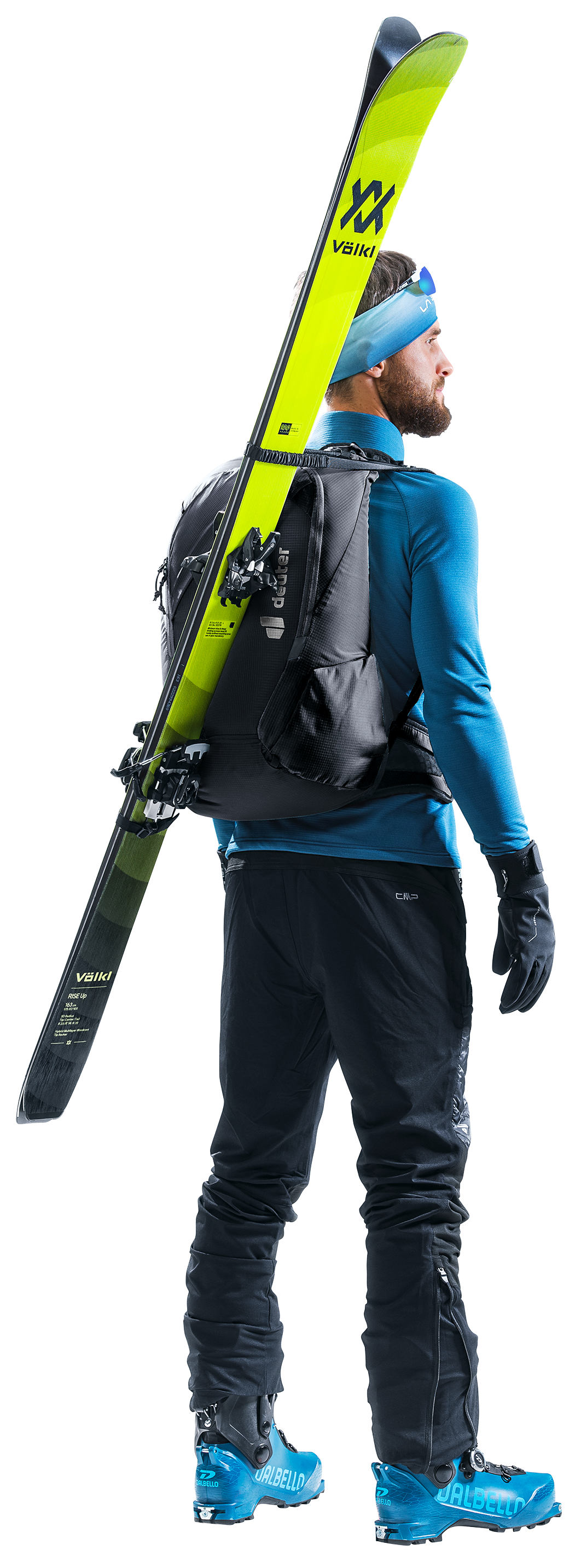 Ski tourer wearing the Deuter Updays 26 with skis carried diagonally