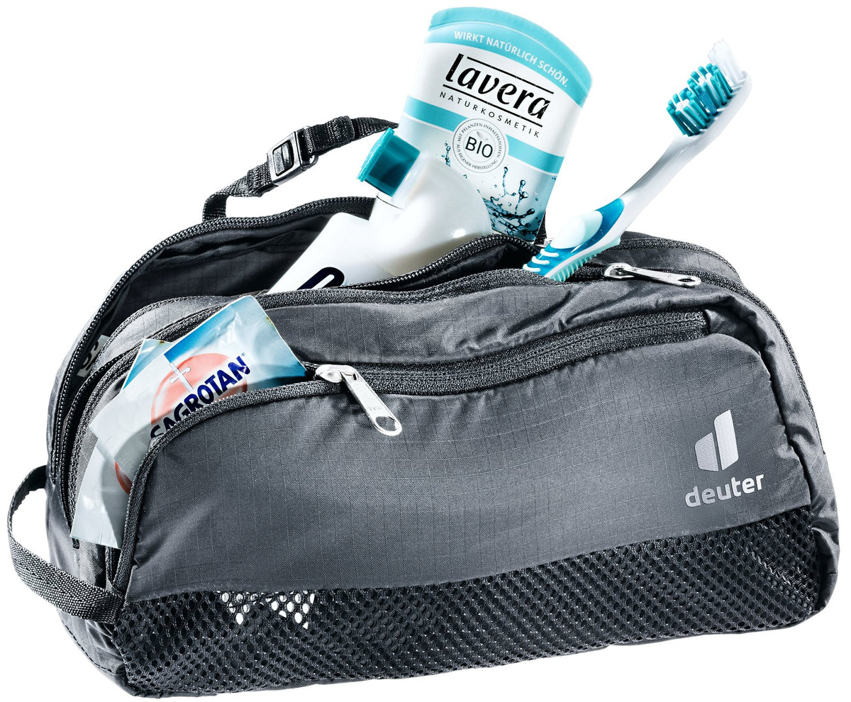 Deuter Wash Bag Tour III in Black, unzipped and packed with toothbrush, toothpaste and toiletries