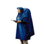 Sea to Summit Nylon Tarp Poncho in Blue worn with the hood up over a backpack, wearer reading a map