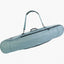 EVOC Board Bag in Steel blue-grey with its shoulder strap raised, three-quarter view