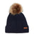 Navy XTM Kids Isla Knit Beanie in dark blue cable knit with brown faux fur pom pom and leather badge