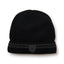 Black XTM Men's Henry beanie with grey striped roll-up cuff and tonal shield badge