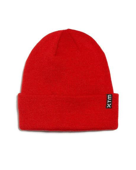 XTM Xpress lightweight beanie in Lava, a bright red acrylic knit with folded cuff and XTM label