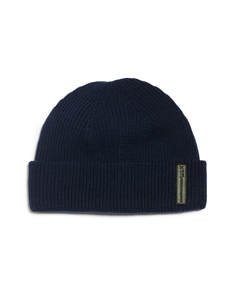 Navy XTM Casey double-walled knit beanie with roll-up hem and badge on the cuff
