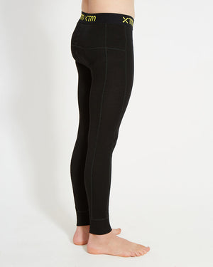 XTM Kids Alpine230 Merino Thermal Pants in Black, side view on a child