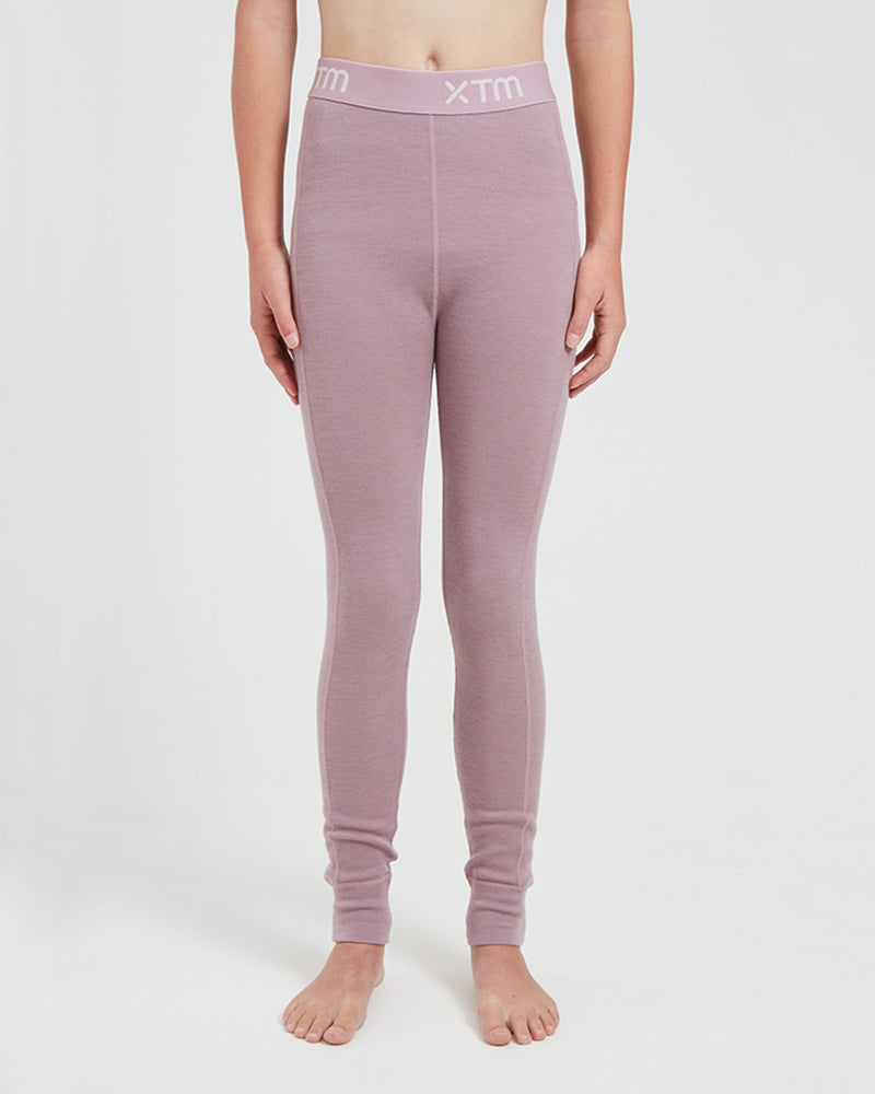 XTM Kids Alpine230 Merino Thermal Pants in Fog, a dusty mauve, front view on a child