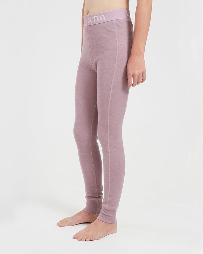 XTM Kids Alpine230 Merino Thermal Pants in Fog, side view showing the seam lines and cuffed ankle
