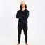 Model in the black XTM Valentino Active200 merino top and matching thermal pants, arms crossed
