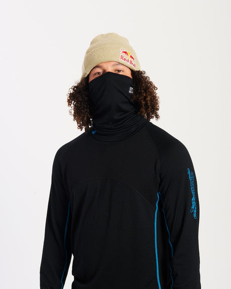 Model wearing the black XTM Valentino merino neck tube pulled up over the nose and mouth, front view