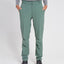 XTM Lara hiking pants in Spruce Green worn with hands in pockets, front view