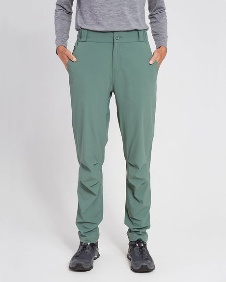 XTM Lara hiking pants in Spruce Green worn with hands in pockets, front view