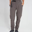 Woman wearing XTM Wye River zip-off hiking pants in Pavement grey with black belt, front view