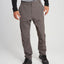 Front view of the XTM Glenaire men's hike pant in Pavement grey worn with hiking shoes