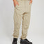 Front view of the XTM Glenaire hike pant in Sand with hands in the front pockets