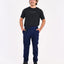 Man wearing the XTM Sturgeon zip-off hiking pant in Naval Blue with a black tee, full length