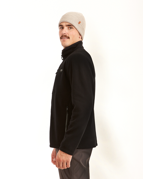 Side view of the black XTM Stanley men's fleece jacket showing the zip pocket