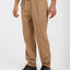 Man wearing the XTM Ironbark pants in Woodsmoke with the black belt and hiking shoes