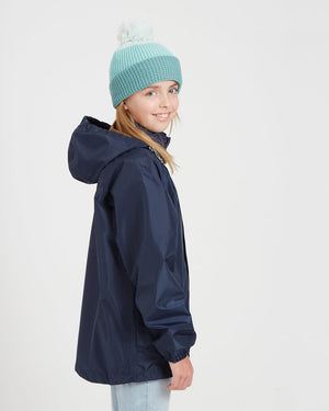 Side view of the XTM Kids Stash 2L rain jacket in Patriot Blue with the hood down