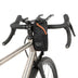 Restrap Race Stem Bag in black beside the stem of a titanium gravel bike with drop bars