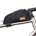 Restrap Top Tube Bag in black on a titanium frame behind the stem, orange zip pull and gold Restrap label