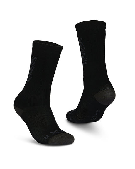 Pair of XTM Kids Dual Density Merino blend snow socks in Black with charcoal heel and toe