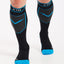 XTM Valentino technical snow socks in black with blue trim and grey shin panels, worn, front view
