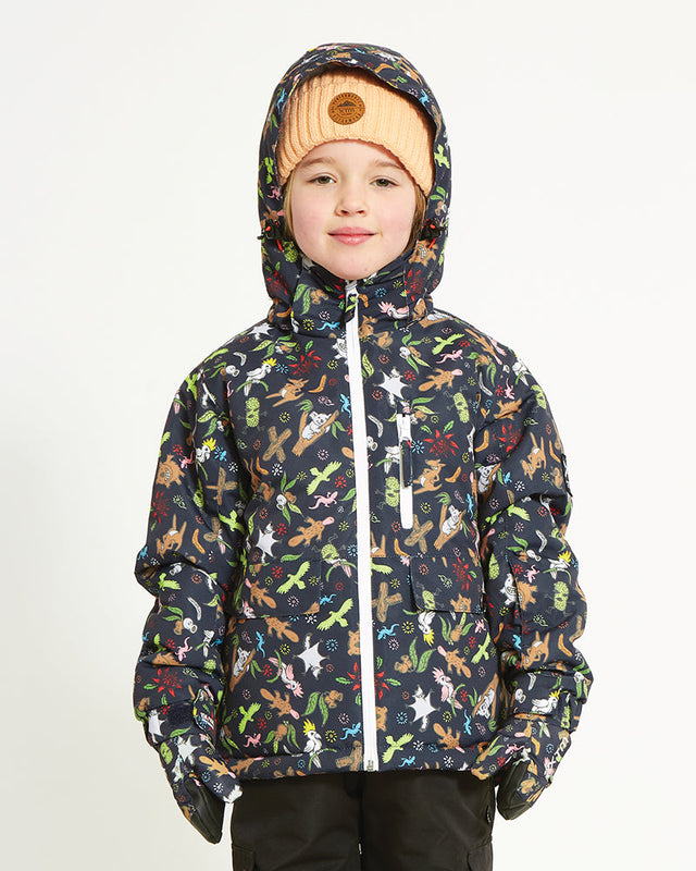 Child wearing the Woodland Navy XTM Kids Yama Snow Jacket with the hood up, front view, white zip