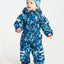 XTM Kids Papoose One-Piece Snow Suit in Blue Dino, front view on a toddler in a teal beanie